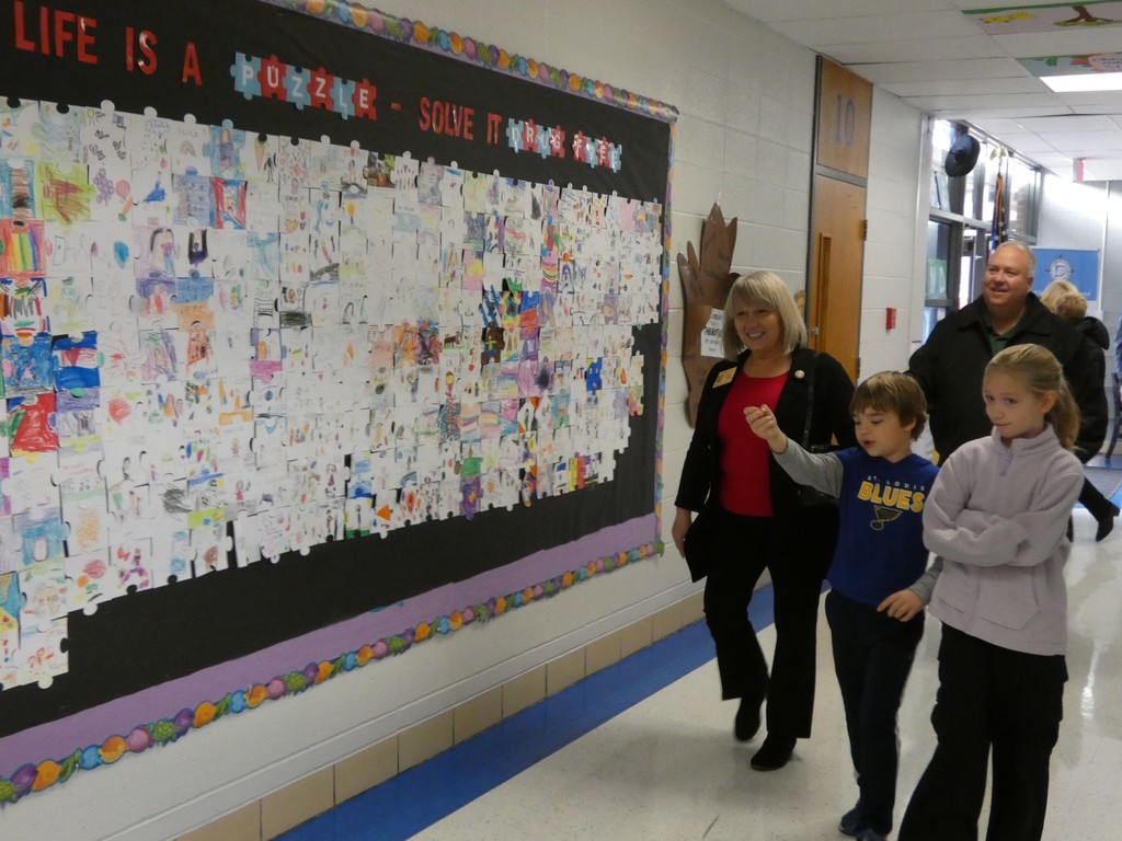 Student leaders escort guests to the classroom