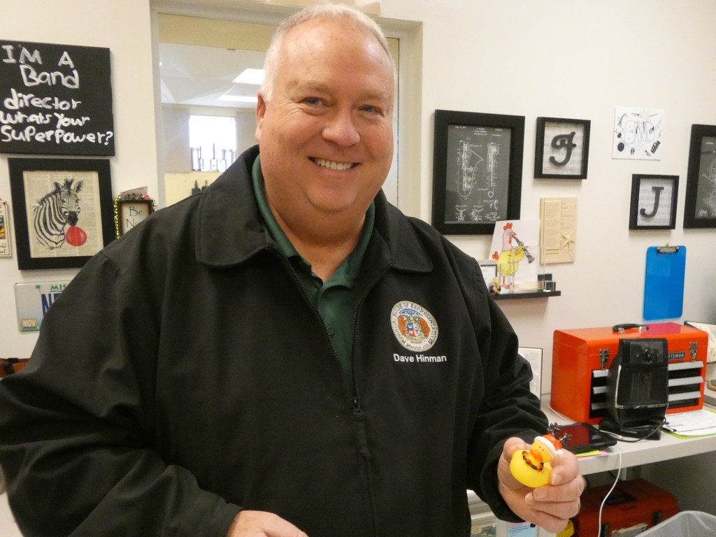 Rep smiles holding reindeer rubber duck
