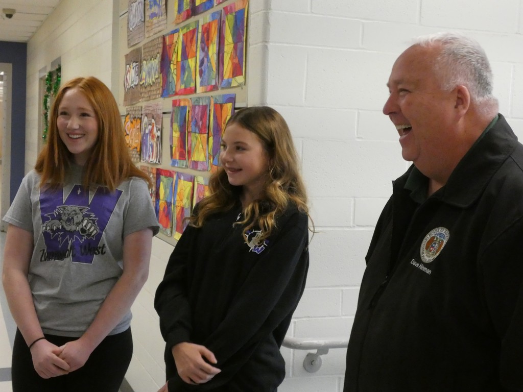 Student tour leaders laugh with state rep
