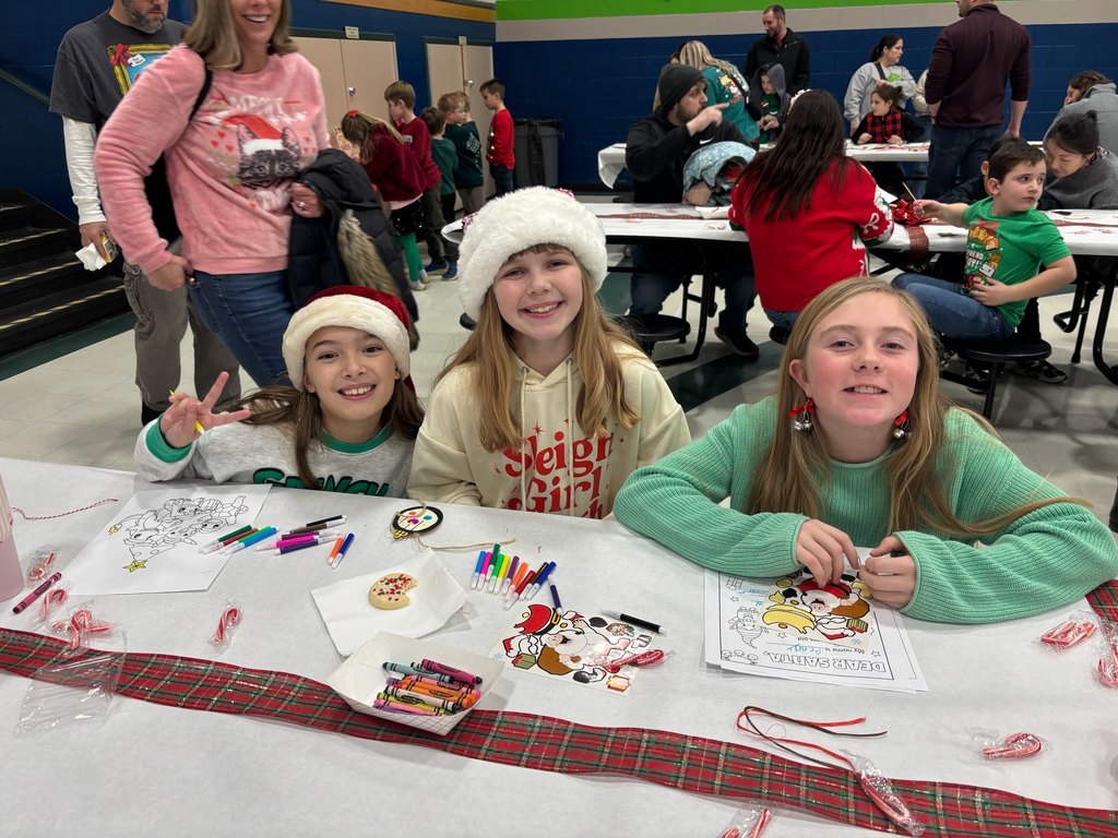 friends enjoy cookies w Santa