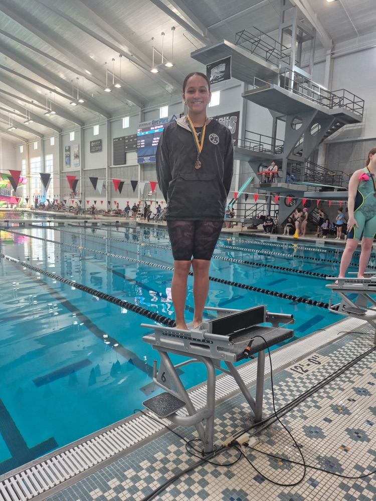 Maya on the blocks with her third place medal