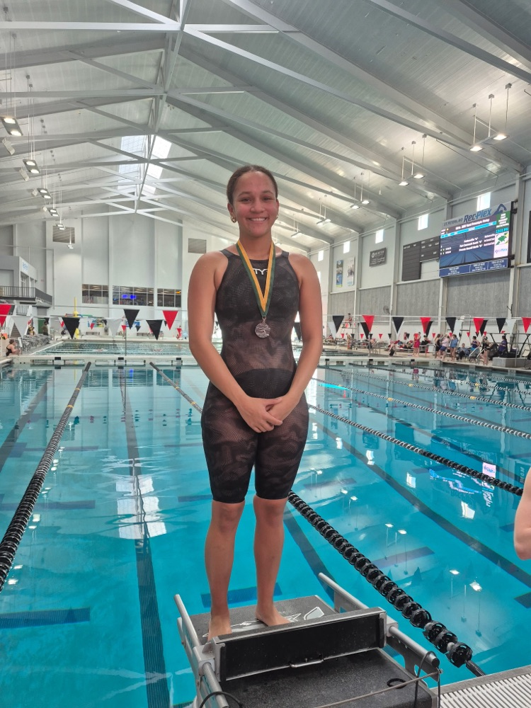 Maya West on the blocks with her 2nd place medal