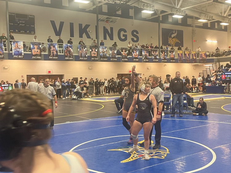 Lana getting her hand raised in victory  