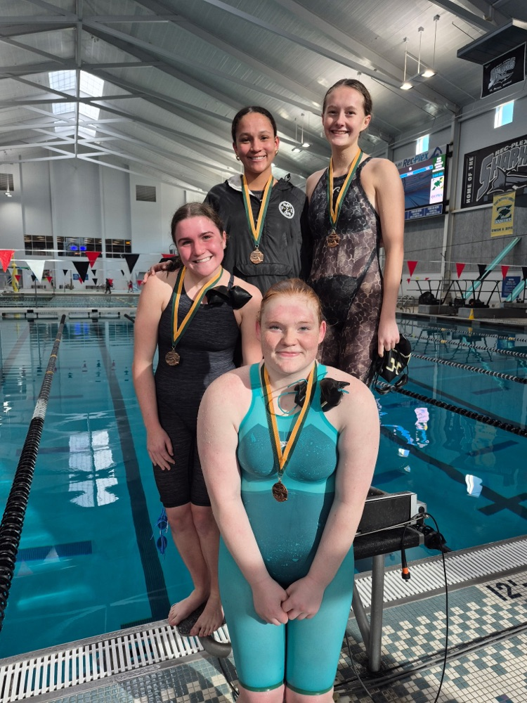 Uptain, Walker, West, and Siders on the podium  