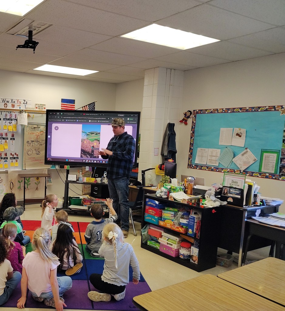Farmer Dyer explains his work on his farm to the class