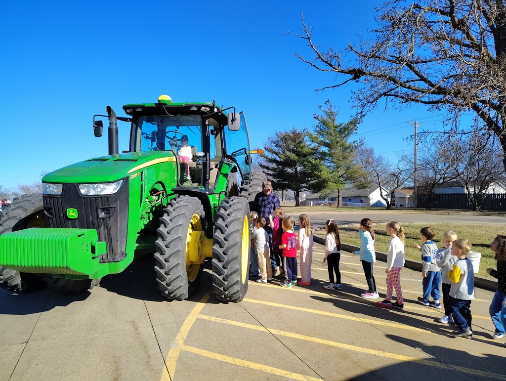 Kindergarteners checking out the tractor