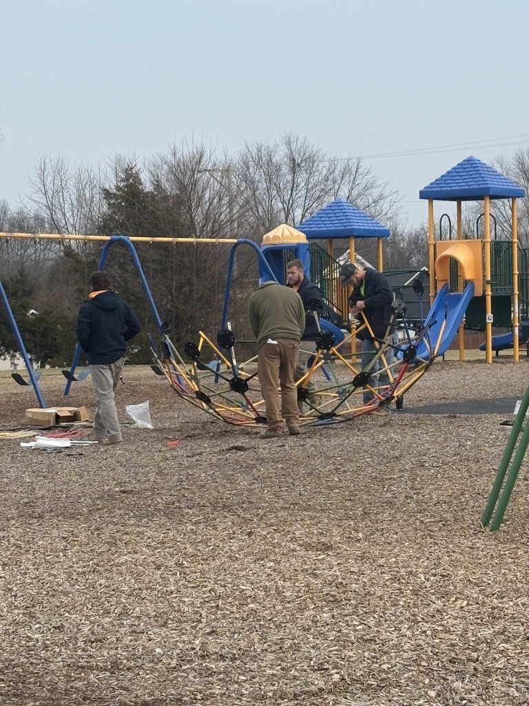 Ft. Zumwalt employees working on installing our new recess equipment