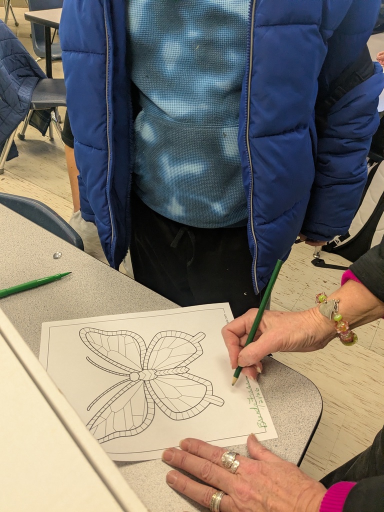 Art club guest works with student