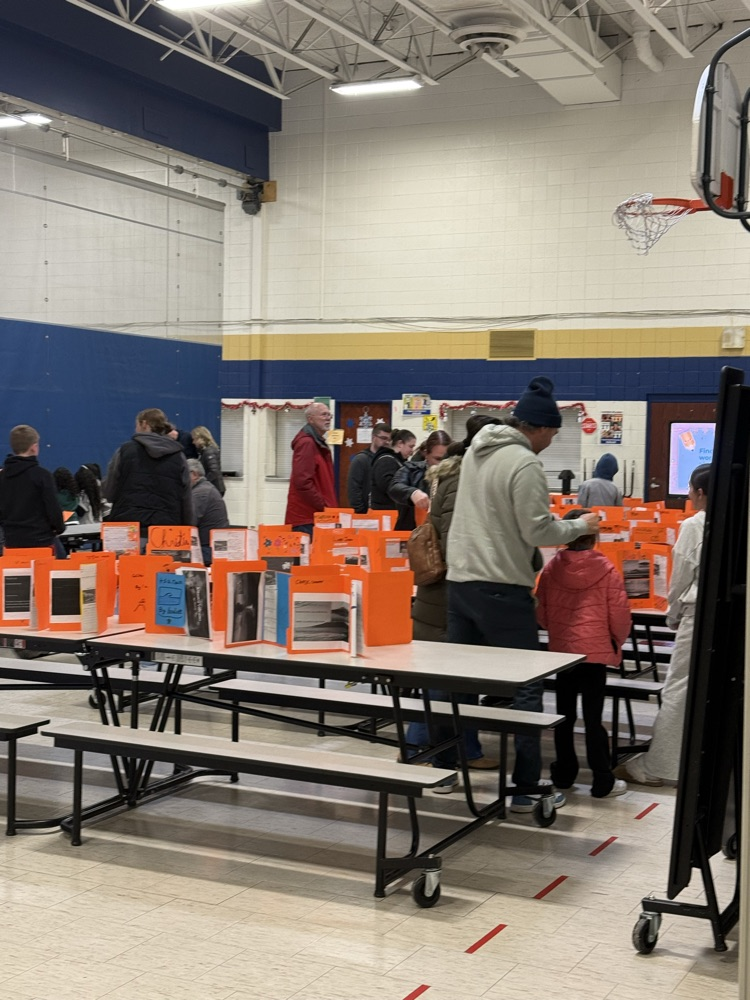 Families playing math games and reading student work samples