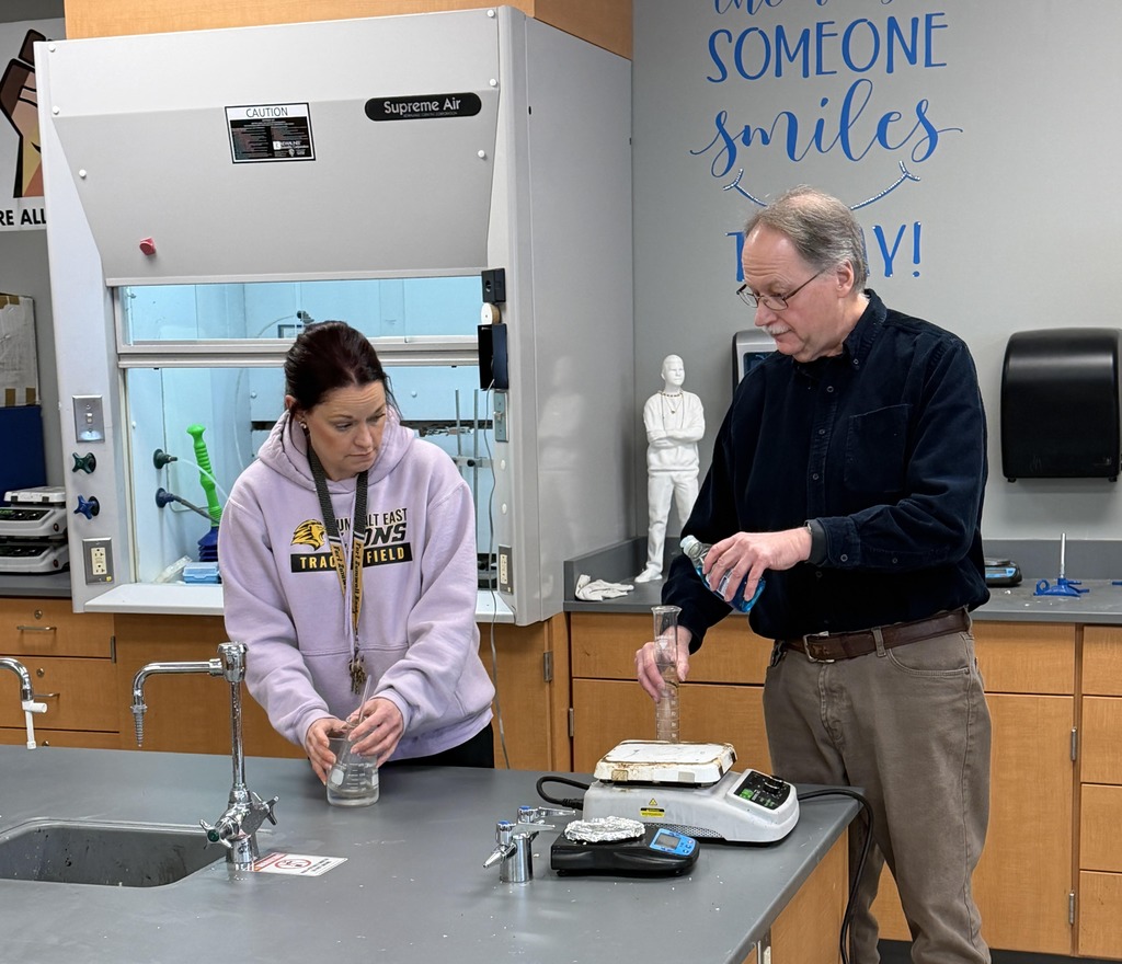 Ms. Russell & Mr. Staines, Chemistry teachers at East High working on an experiment for Chemistry classes during PLCs 