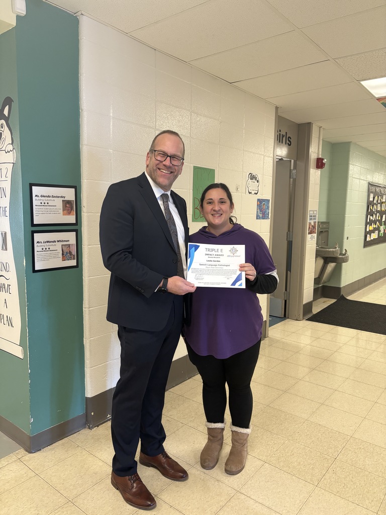 Dr. Henry St. Pierre and Mrs. Gerdes' with her Triple E award