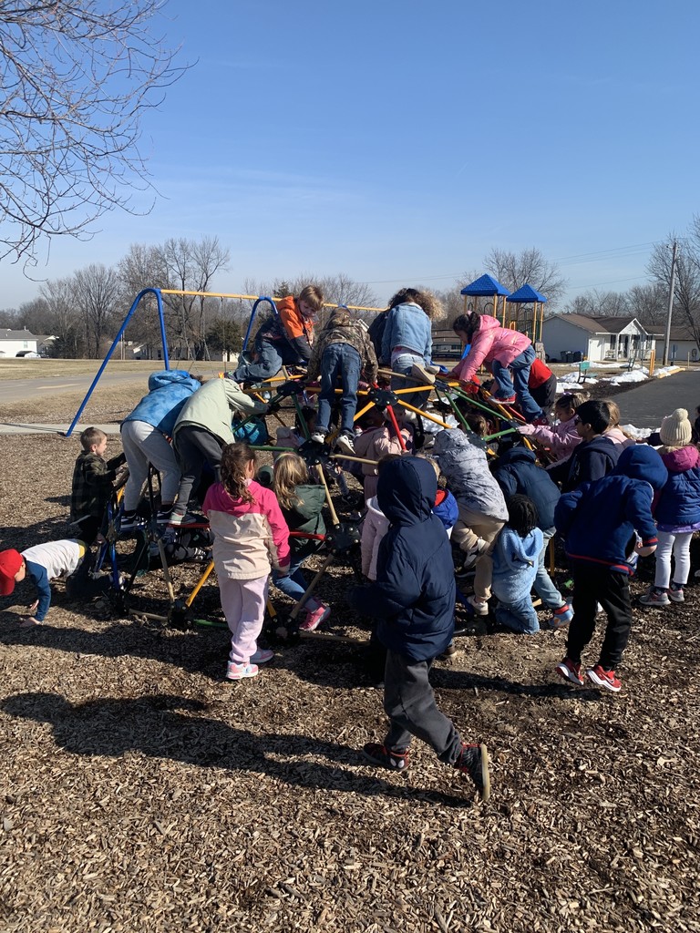 Kindergarten students climbing on our new climbing dome