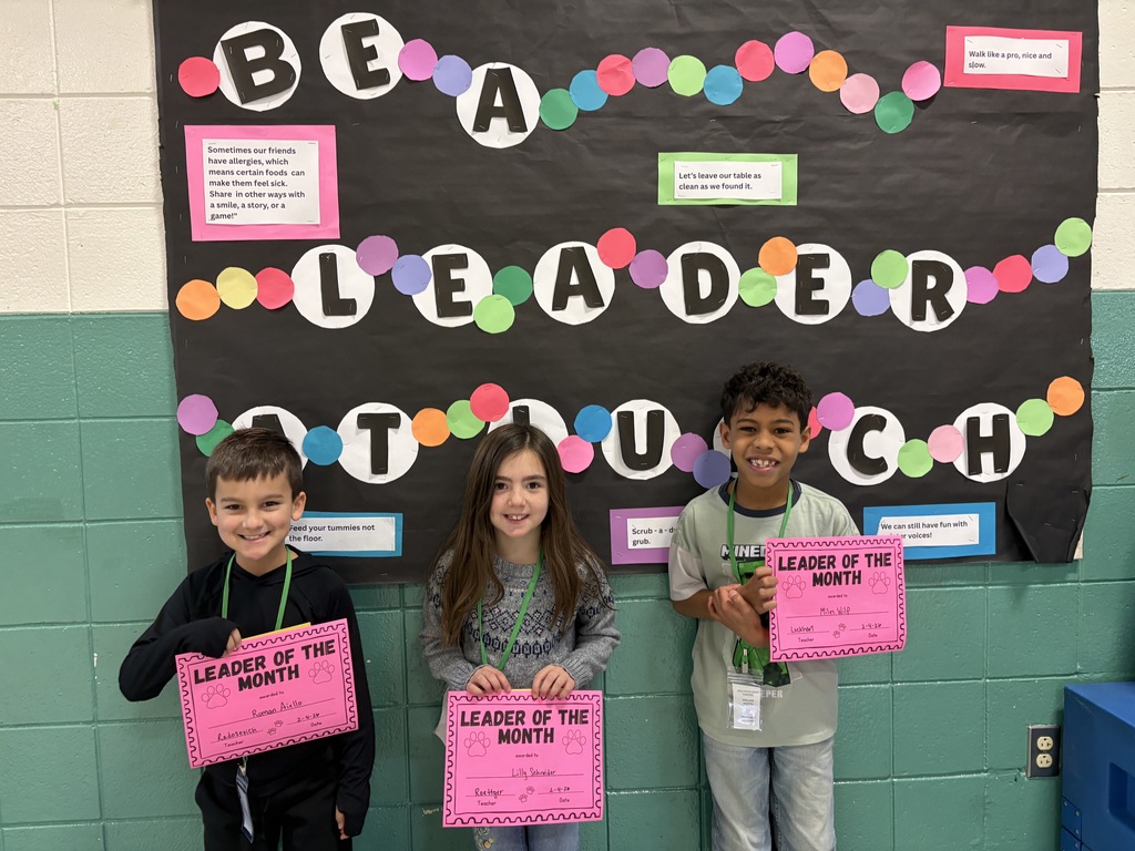 Leader of the month 2nd-grade students with their awards