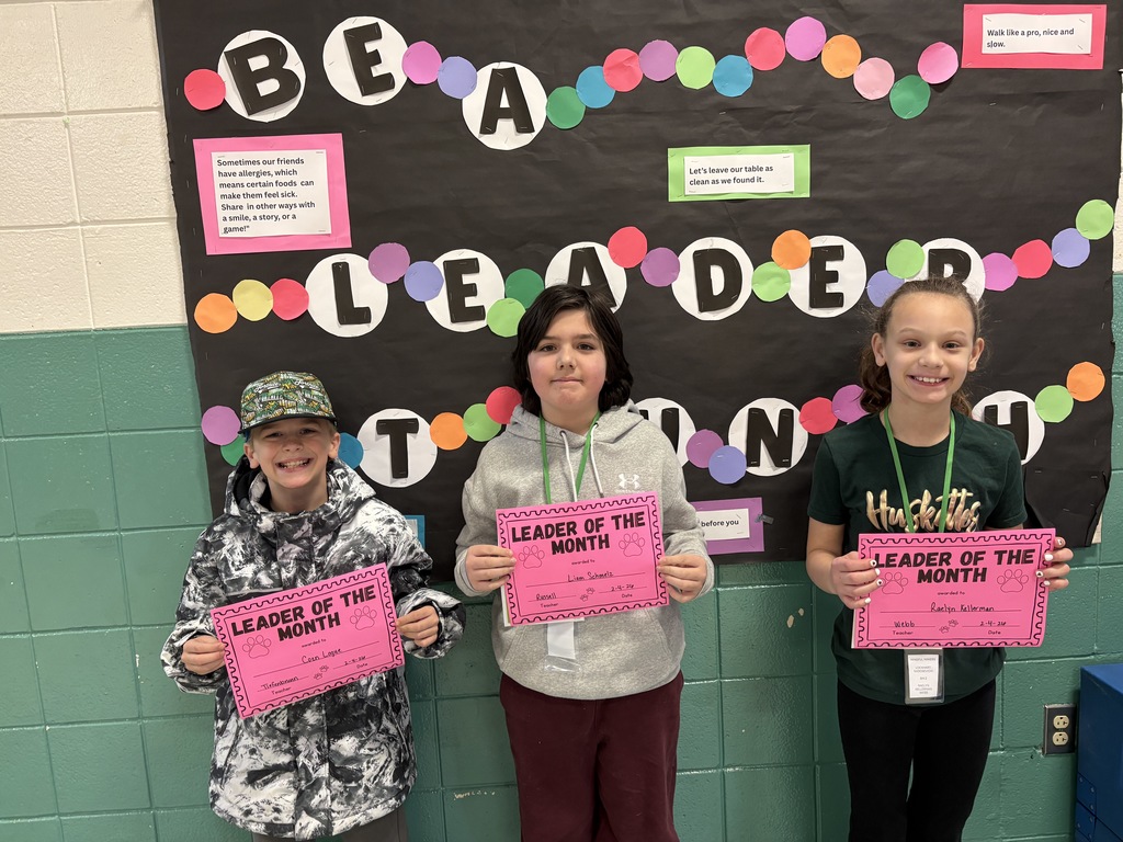 Leader of the month 4th-grade students with their awards