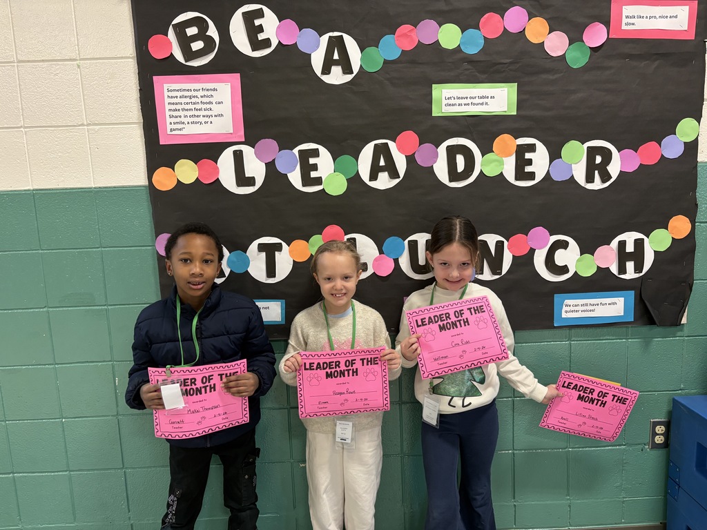 Leader of the month 1st-grade students with their awards