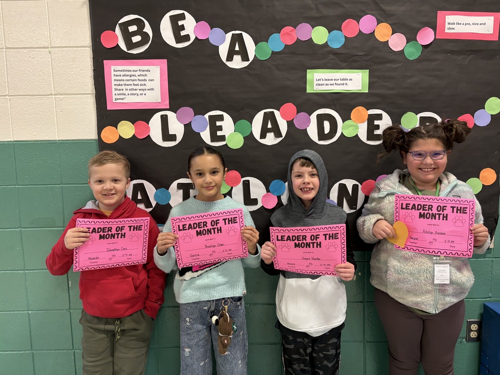 Leader of the month 3rd-grade students with their awards