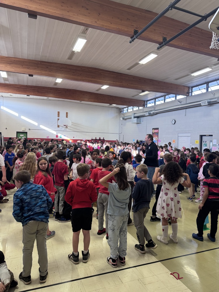 students standing during an assembly