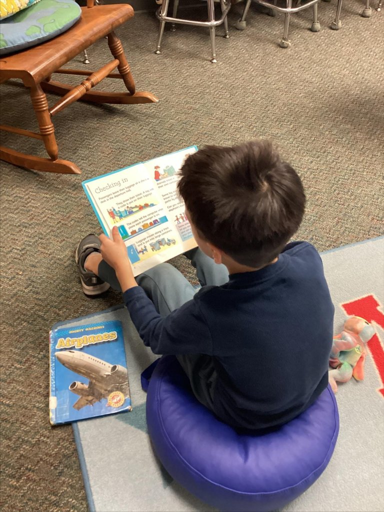 student reading a story in library