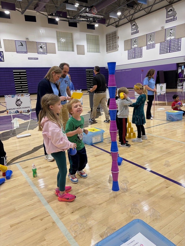 Kindergarten students looking at their  finished cup tower!