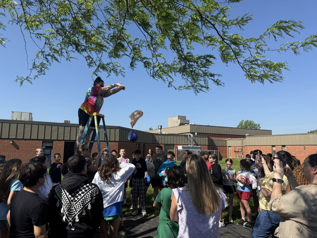 Teacher drops egg for an egg drop challenge
