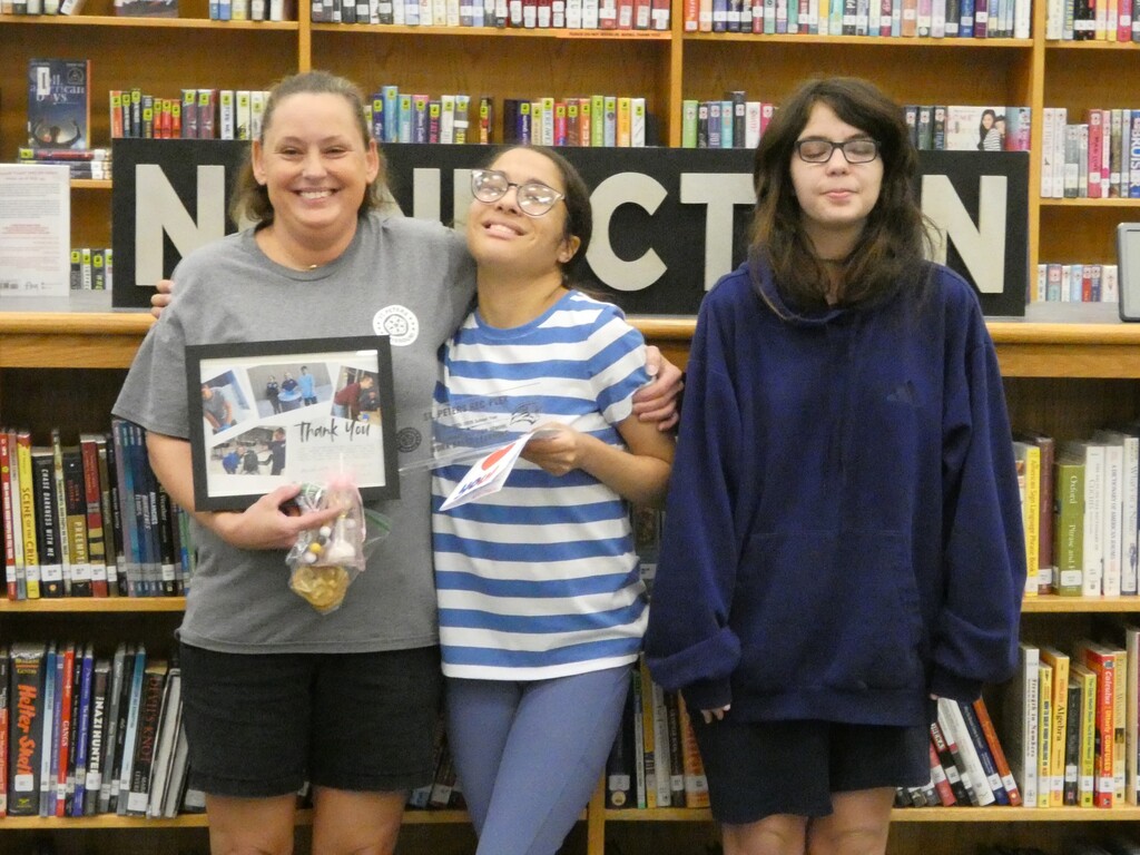 Students pose with business partner