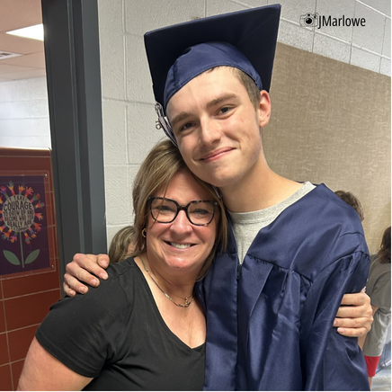 Grad stops to give teacher a hug