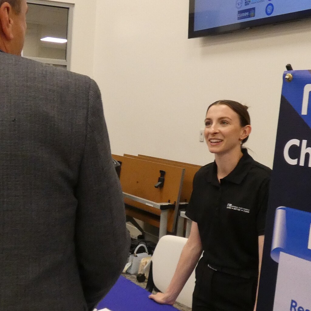 reps from partner businesses talk with guests