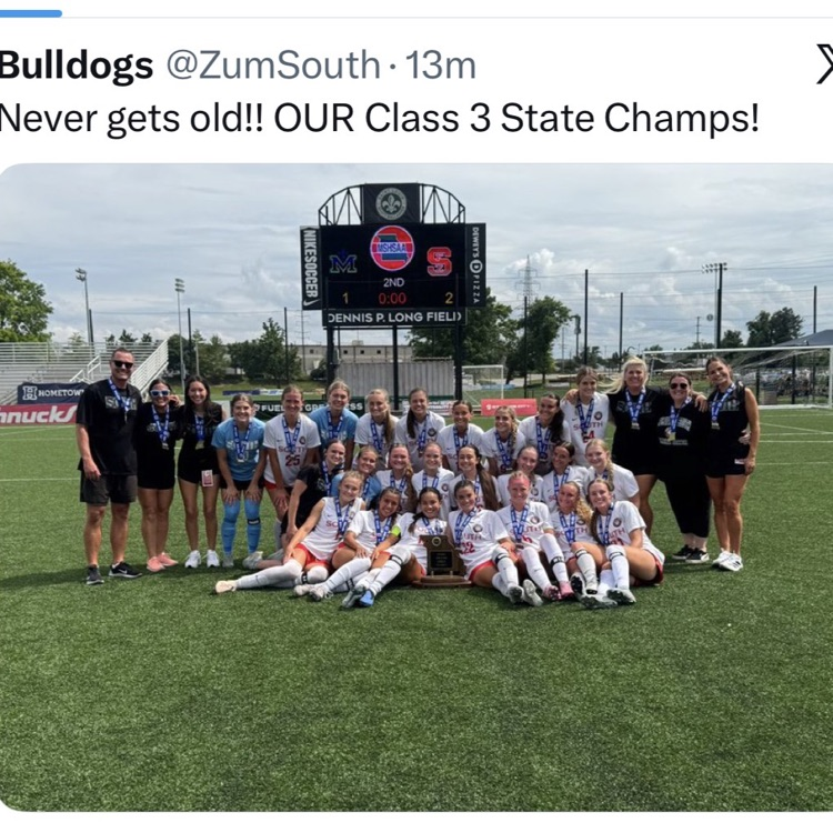 Team poses with state trophy.