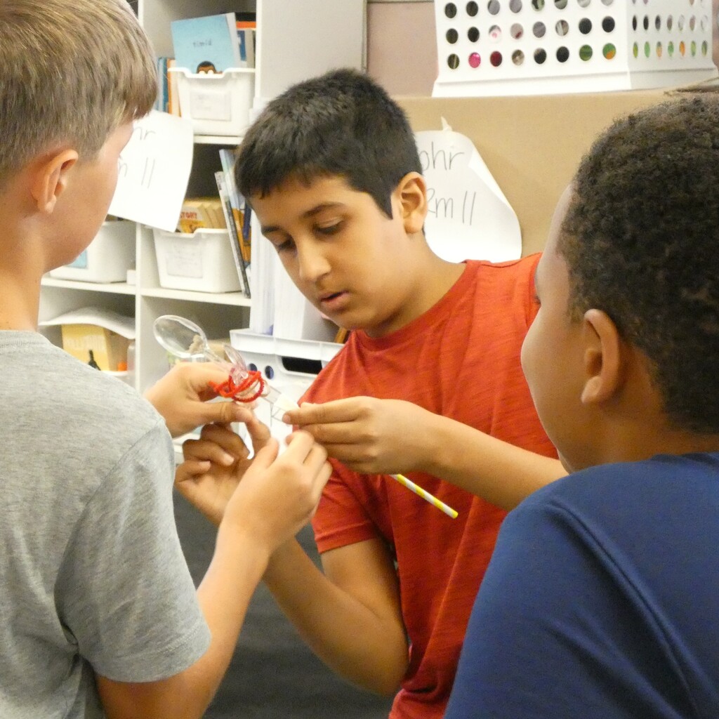 team wraps spoons and straws with pipe cleaners