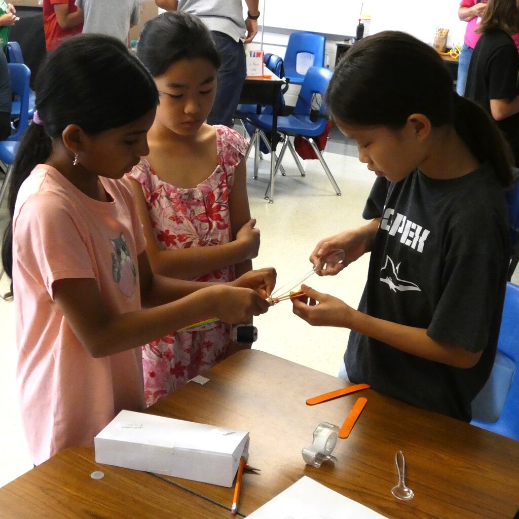 team assembles grabber with nail files and rubber bands
