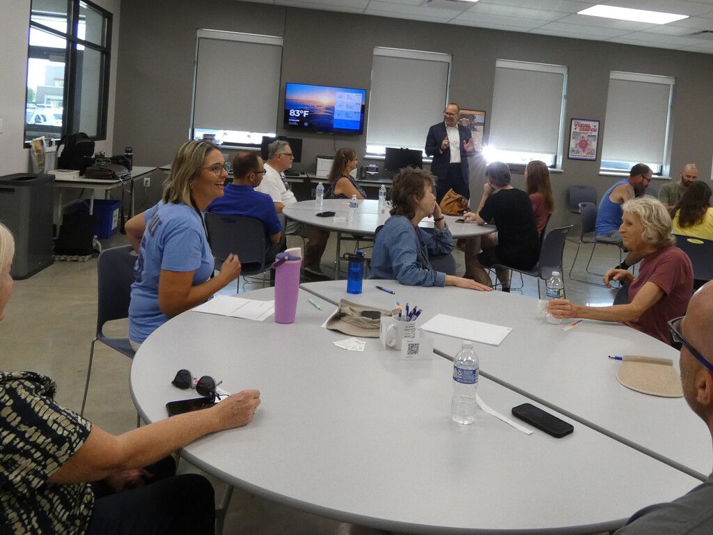 In small groups, guests and district leaders discussed a few questions
