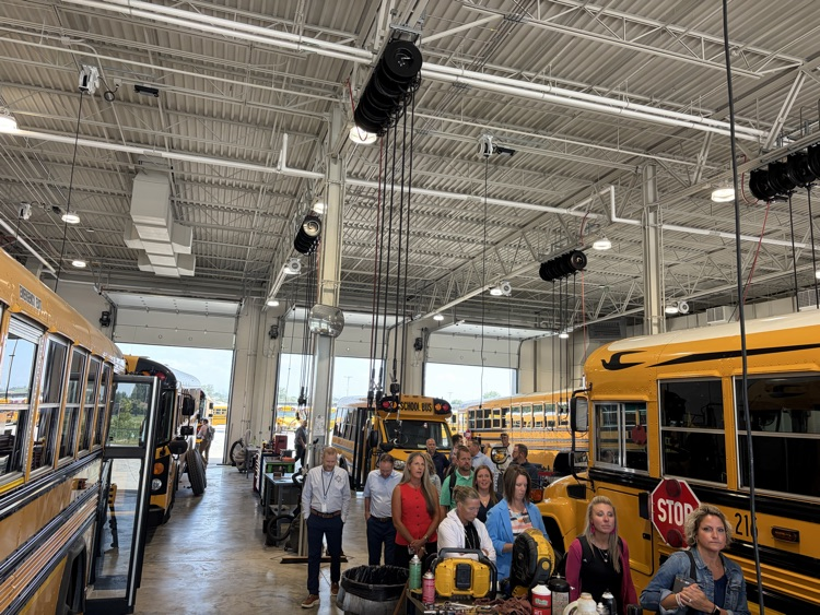 The maintenance and service garage, with several school buses, parked inside