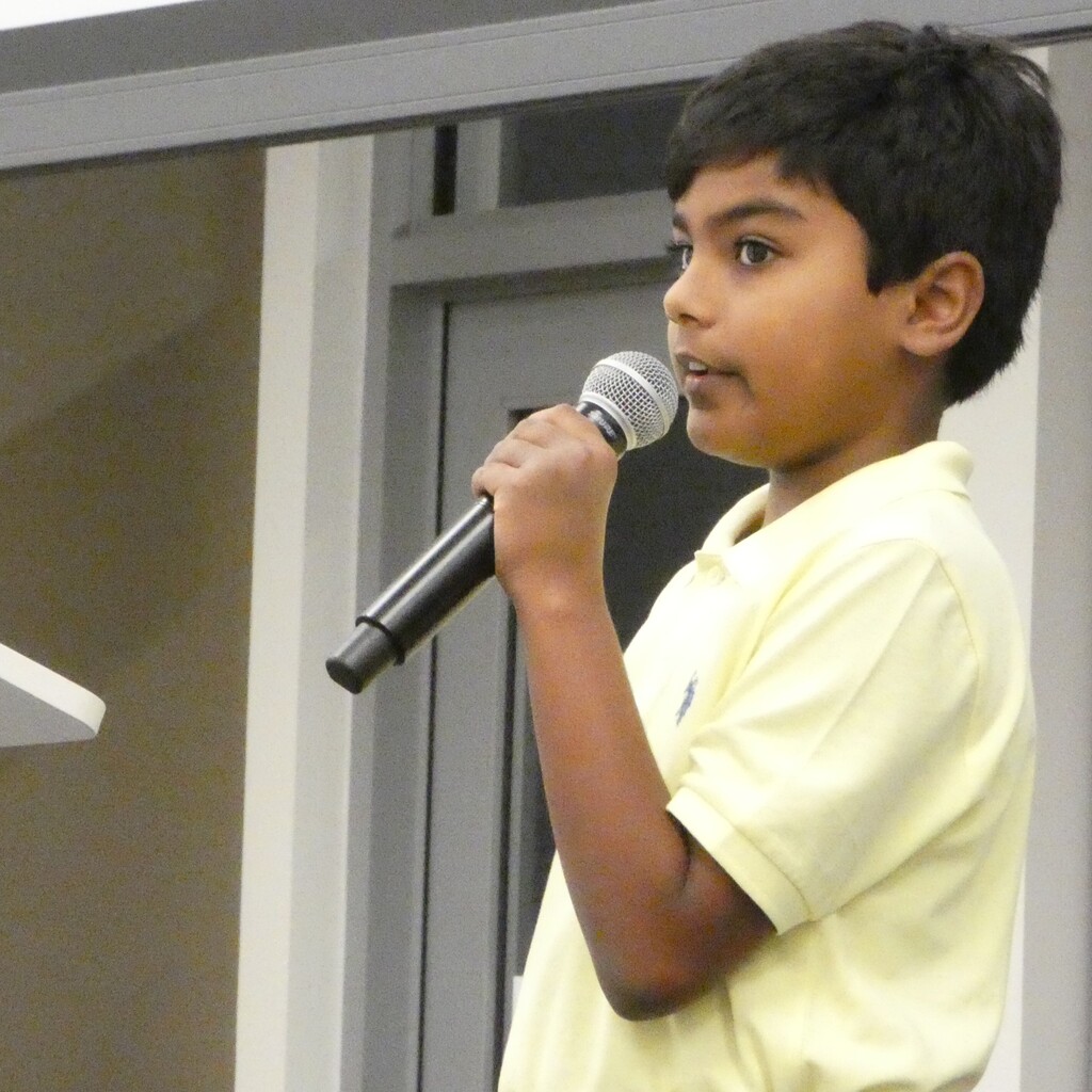 student speaker takes the mic