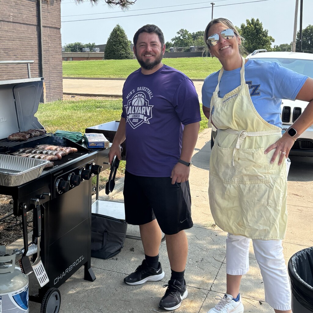 administrators work the grill