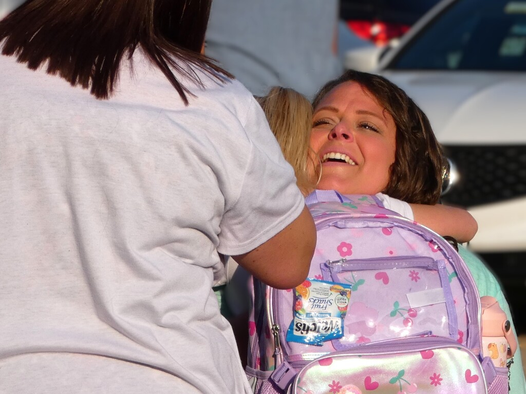 mom hugs kindergartener good bye