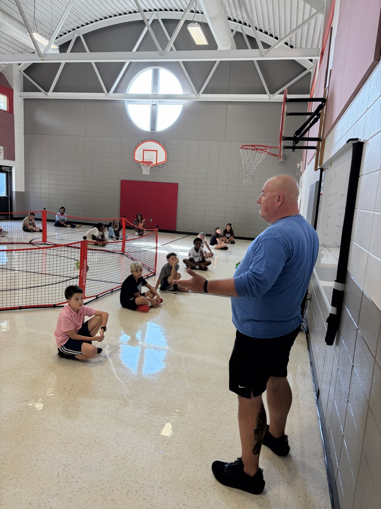 PE coach with students
