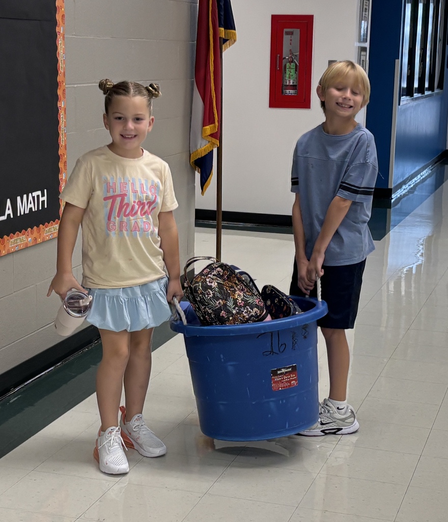 student leaders taking care of the classroom lunch tub