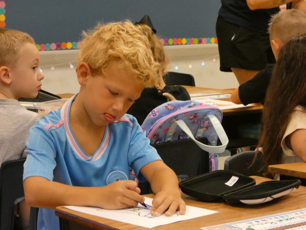 1st grader working hard in class