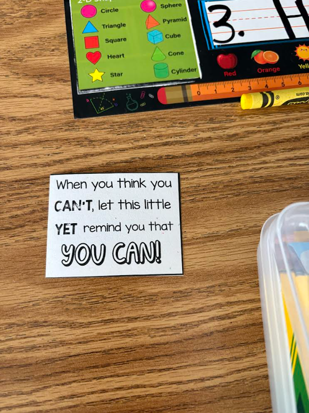 A sign on a desk that says, "When you think you can't, let this little yet remind you that you can!"