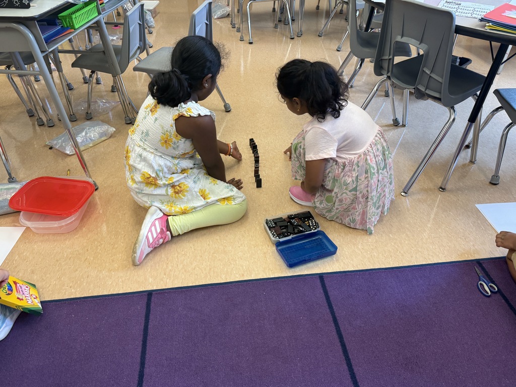 students with dominoes