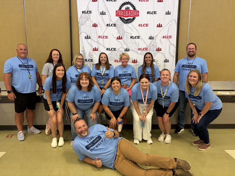 several educators wearing blue shirts
