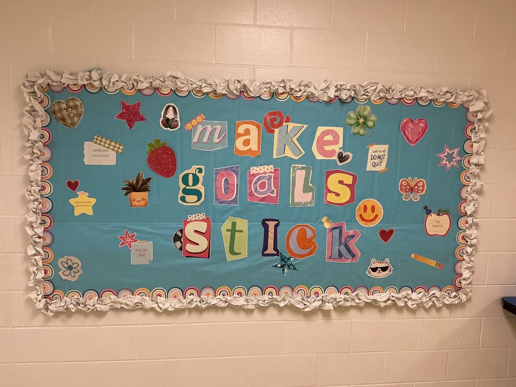 A bulletin board that says make goals stick.