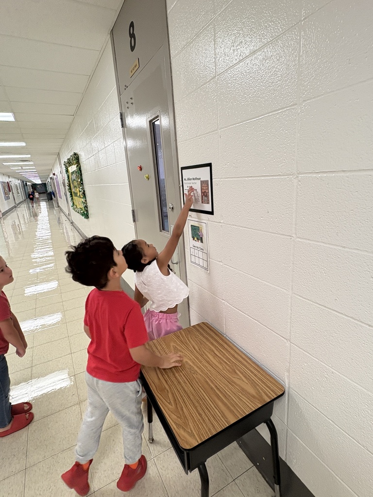 A group of students on a scavenger hunt with their teacher.