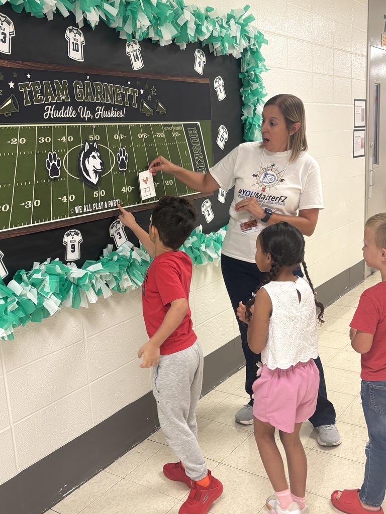 A group of students on a scavenger hunt with their teacher.