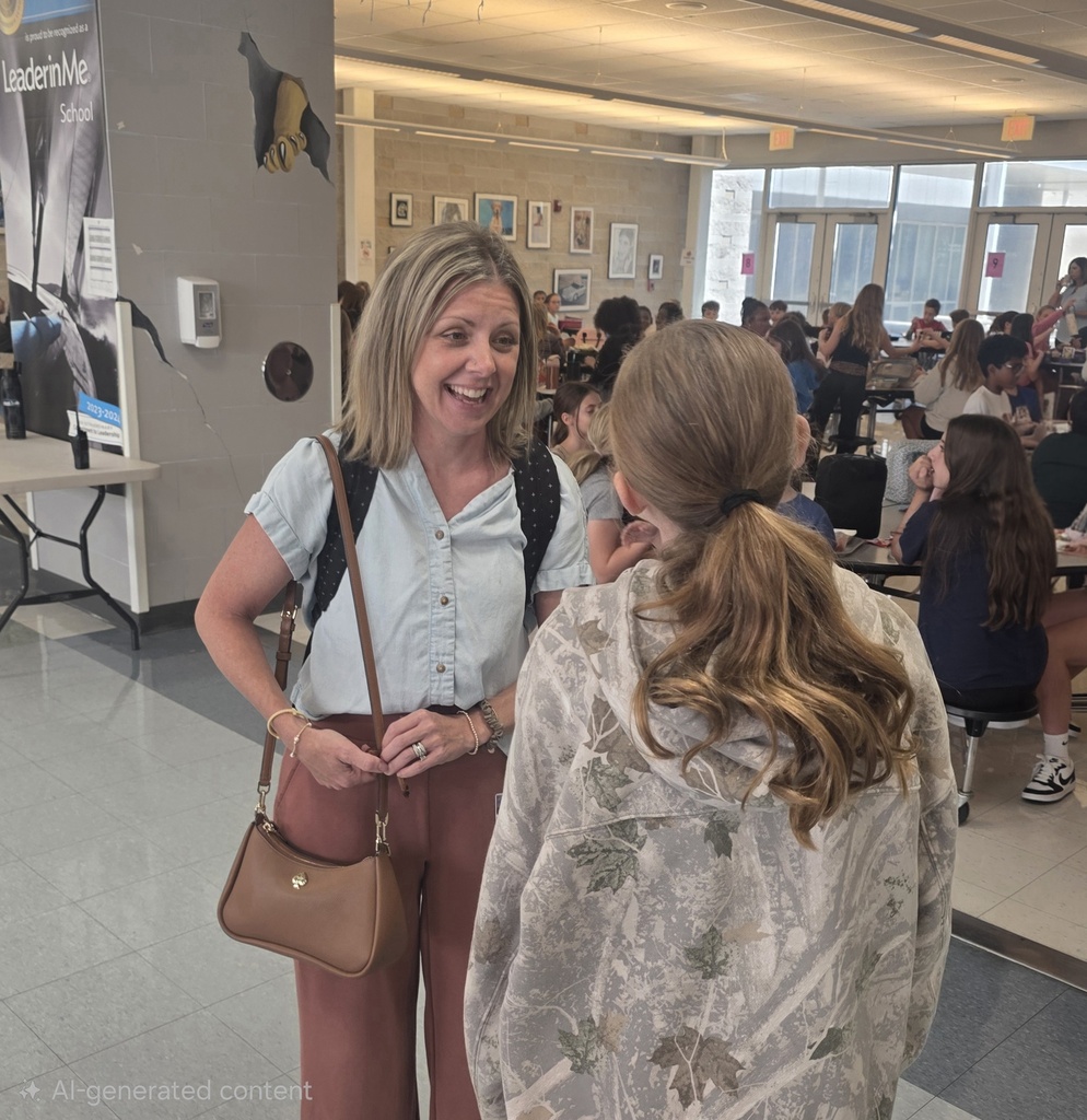 Mrs. Michalka connecting with a student at lunch.