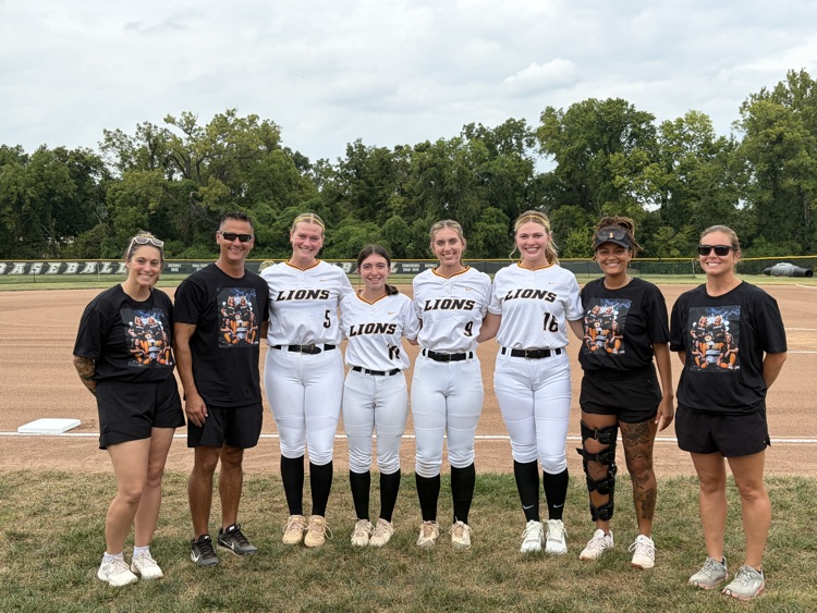 Senior softball players with our coaches