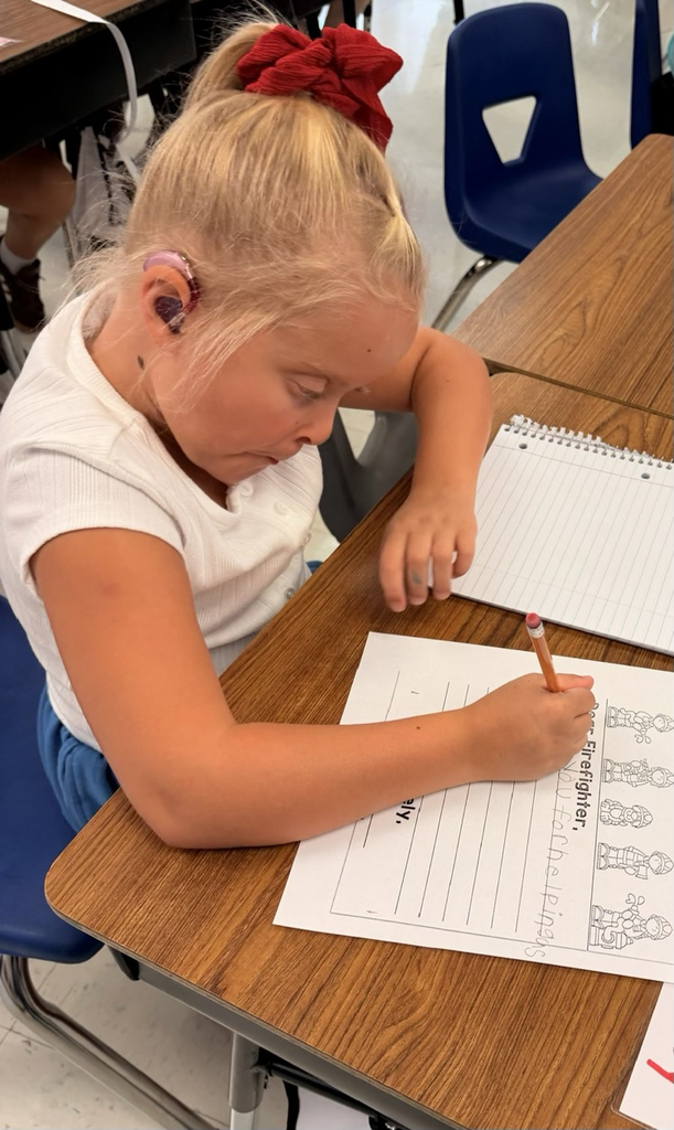 student writing about firemen