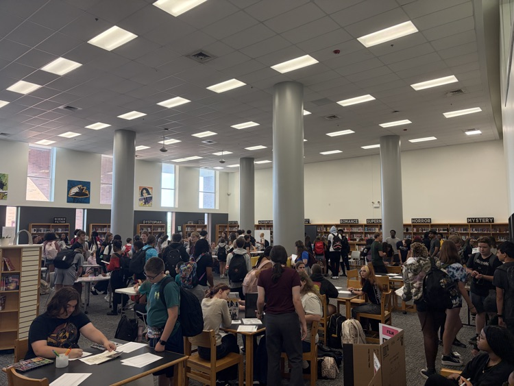 a large crowd of FZE students learning about clubs and sports in our library