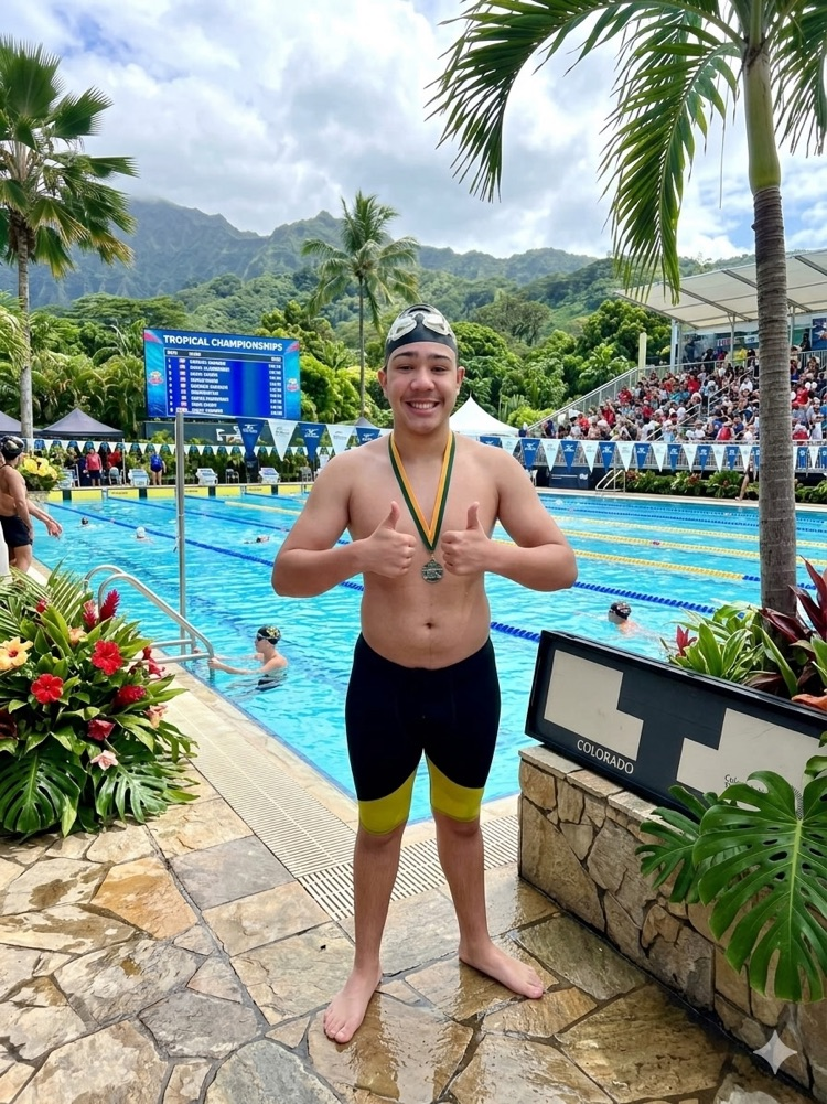 Nevan posting with a medal