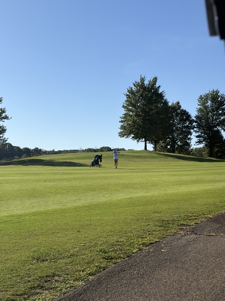 Ali hitting her approach shot 